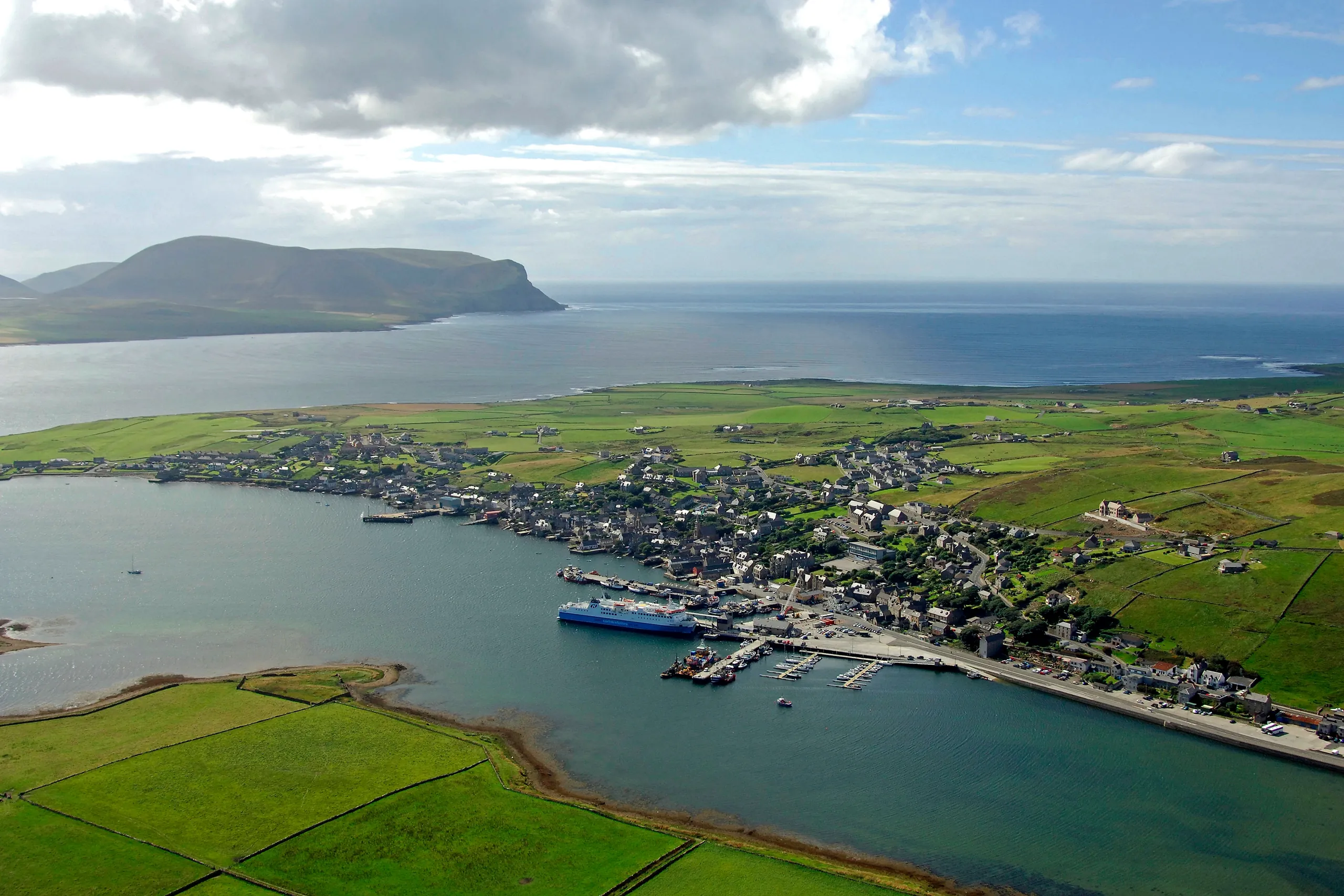Aerial view of Stromness harbour and Orkney coastline