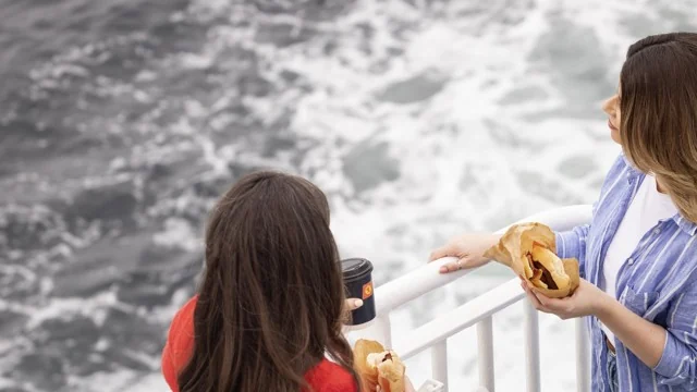 Passengers on the open deck aboard CalMac ferry MV Clansman