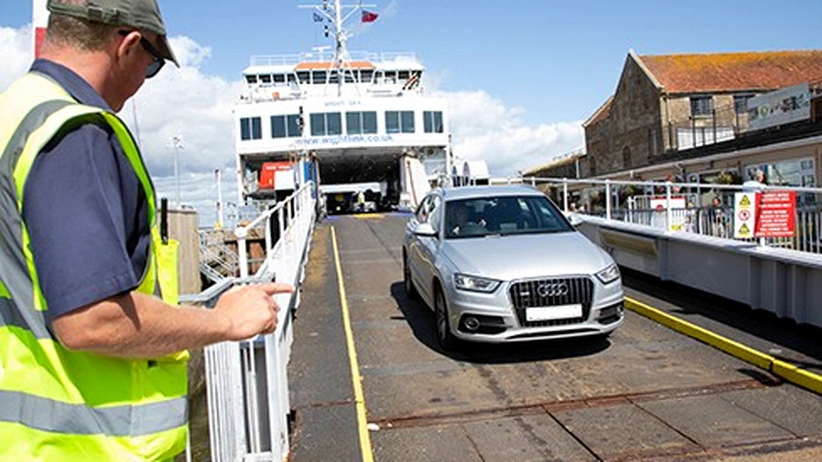 Car leaving a Wightlink ferry at the terminal